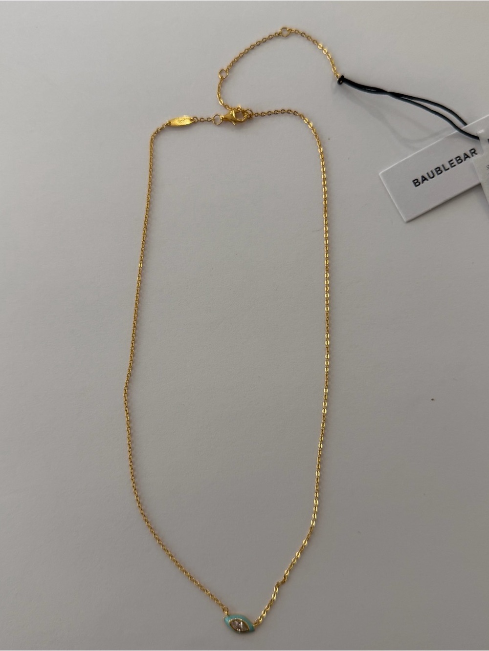 BaubleBar Gold Necklace with Turquoise and White Evil Eye Charm